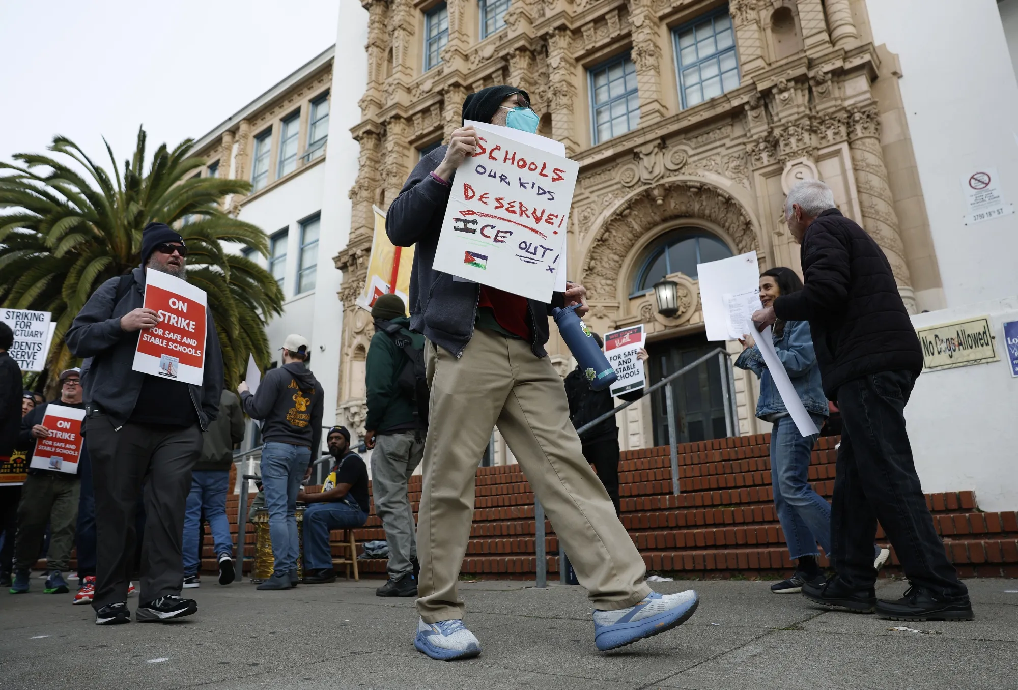 Teachers with the San Francisco Unified School District picket outside of Mission High School on the first day of a citywide teachers' strike in San Francisco on Feb. 9.