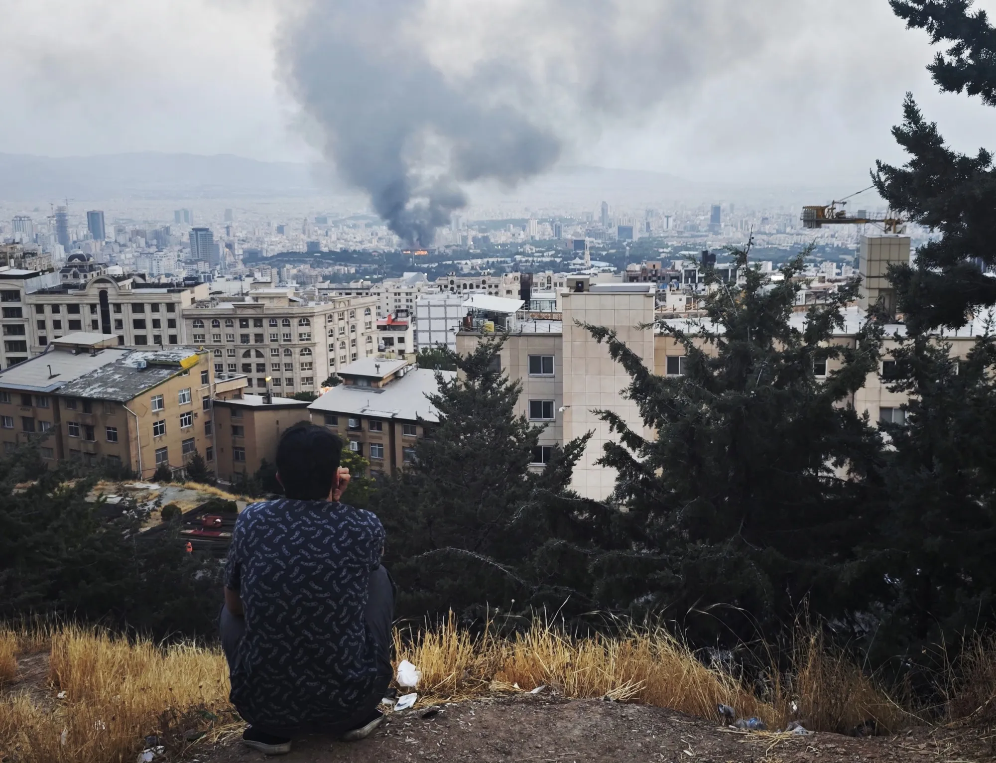 Smoke rises after a reported strike on a building used by Islamic Republic of Iran News Network, part of Iran's state TV broadcaster, in Tehran, on June 16.