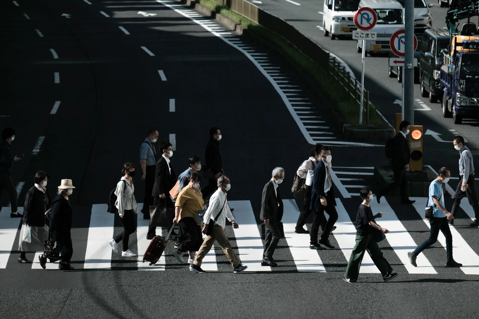 Pedestrians cross a road in Tokyo, Japan, on&nbsp;May 14.