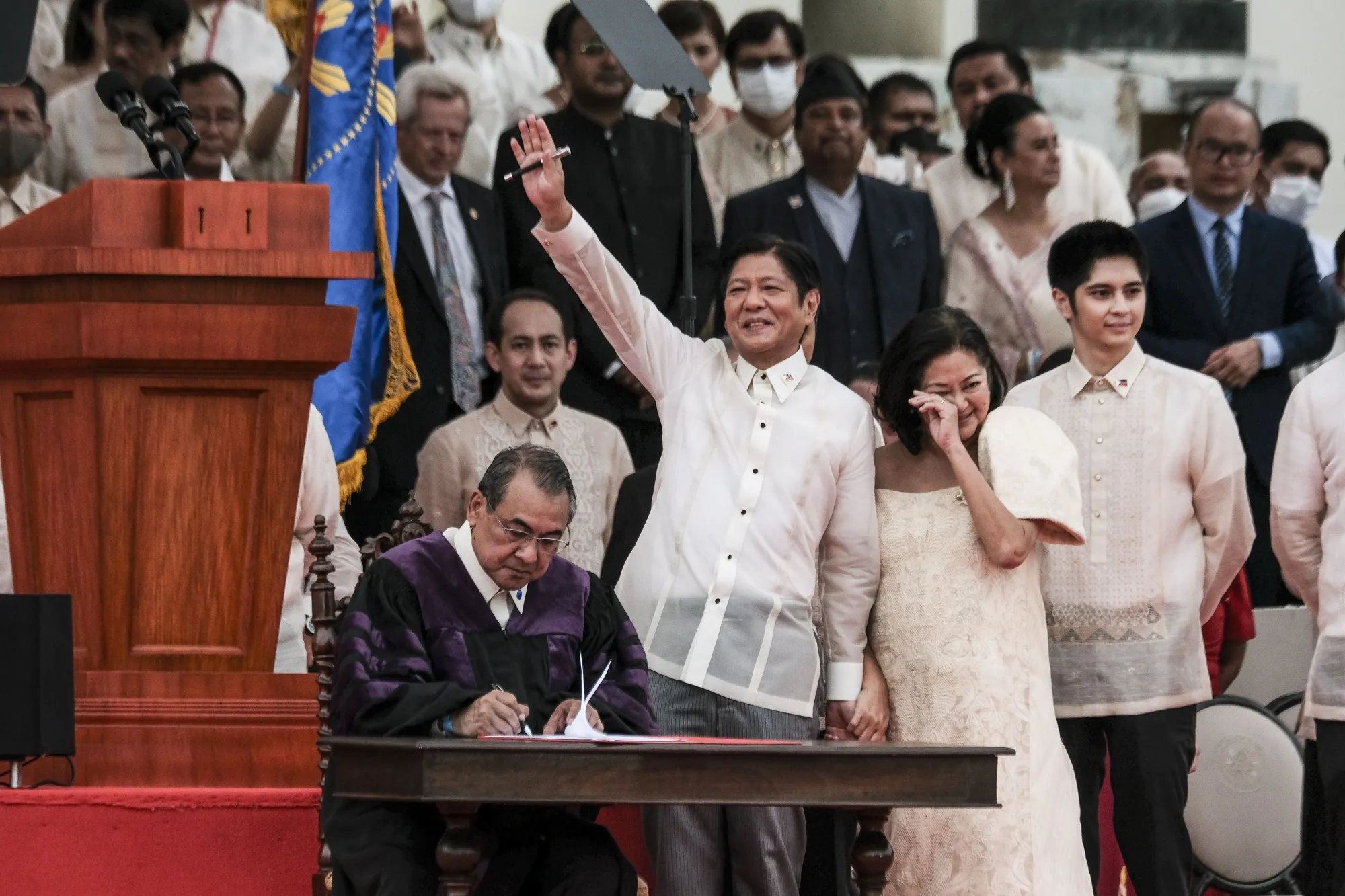 Ferdinand "BongBong" Marcos Jr., waves during a swearing-in ceremony at the Old Legislative Building in Manila, on June 30.