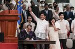 Ferdinand &quot;BongBong&quot; Marcos Jr., waves during a swearing-in ceremony at the Old Legislative Building in Manila, on June 30.