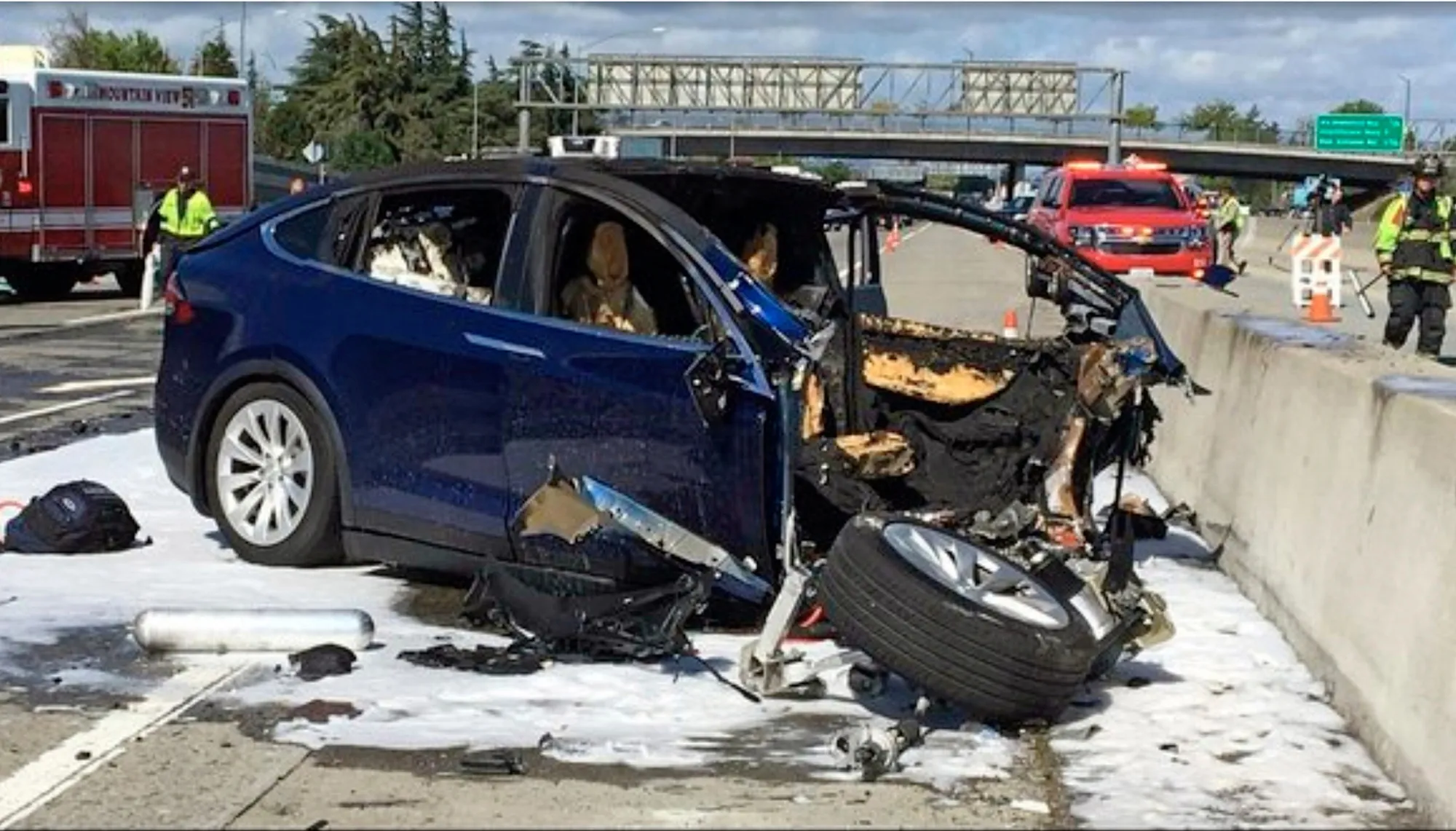 Emergency personnel at the scene where Walter Huang’s Tesla Model X crashed into a roadside barrier in Mountain View, California.