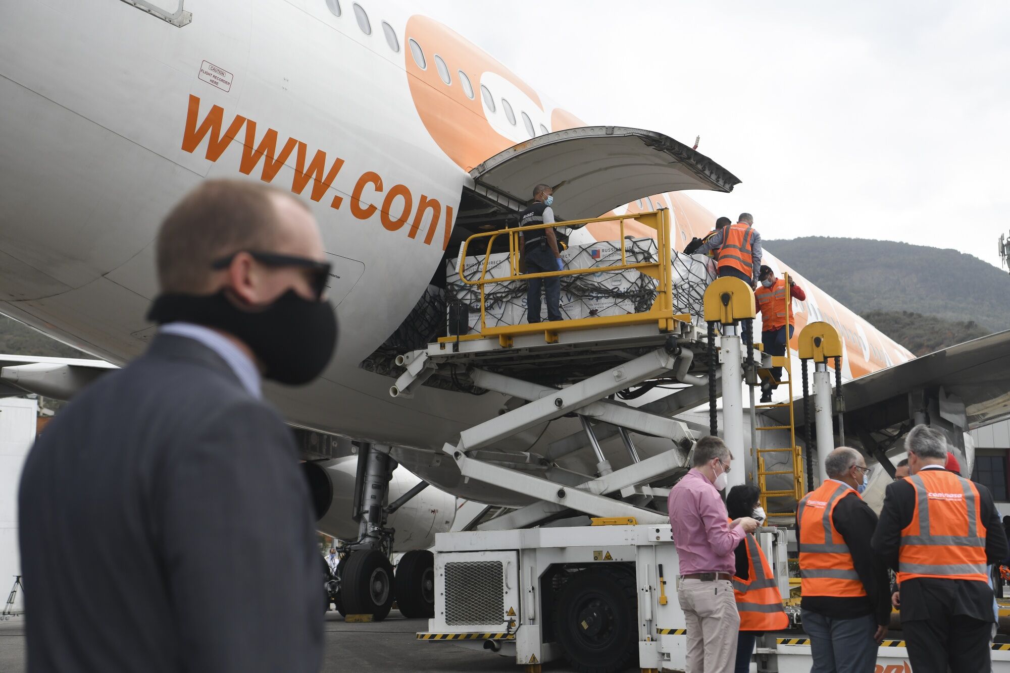 Refrigerated containers carrying Sputnik V Covid-19 vaccines exit an aircraft at Simon Bolivar International Airport (CCS) in Maiquetia, Venezuela, on Feb. 13.