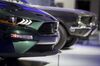 A headlight of the 2019 Ford Motor Co. Mustang Bullitt sports vehicle is seen during the 2018 North American International Auto Show (NAIAS) in Detroit, Michigan, U.S., on Tuesday, Jan. 16, 2018. After auto executives spent years trying to convince the world they can beat Silicon Valley to electric cars and autonomous driving, they are finally getting a chance to crow once again about what they do best: trucks. Each of the hometown brands will pull the cover off of a new flatbed, while at least three of the luxury brands roll out new SUVs.