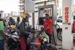 An attendant refuels a motorcycle taxi at a gas station in Nairobi, Kenya.