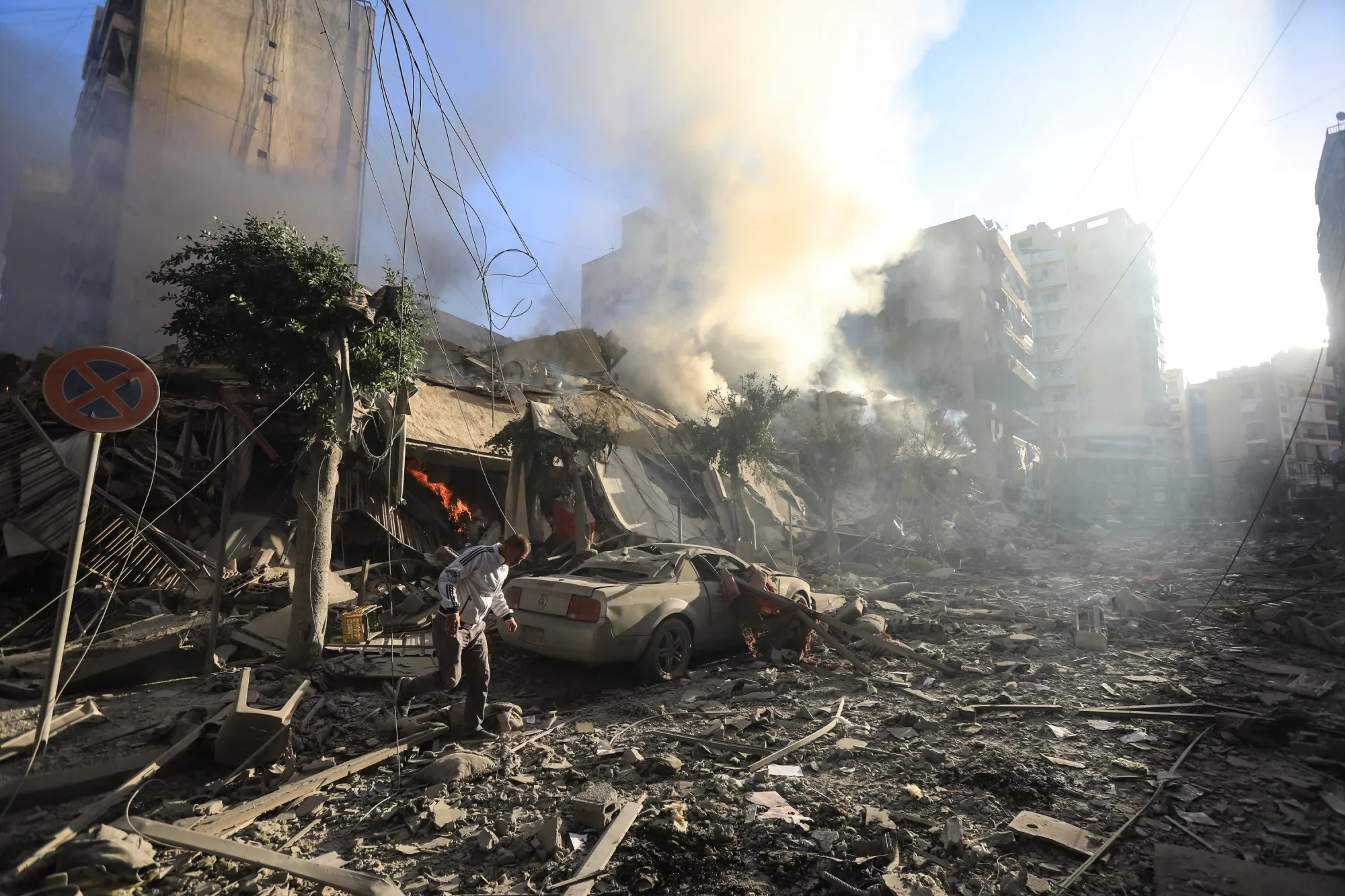 A man walks in the rubble of a building hit by an Israeli airstrike on Beirut's southern suburbs on Oct. 3.