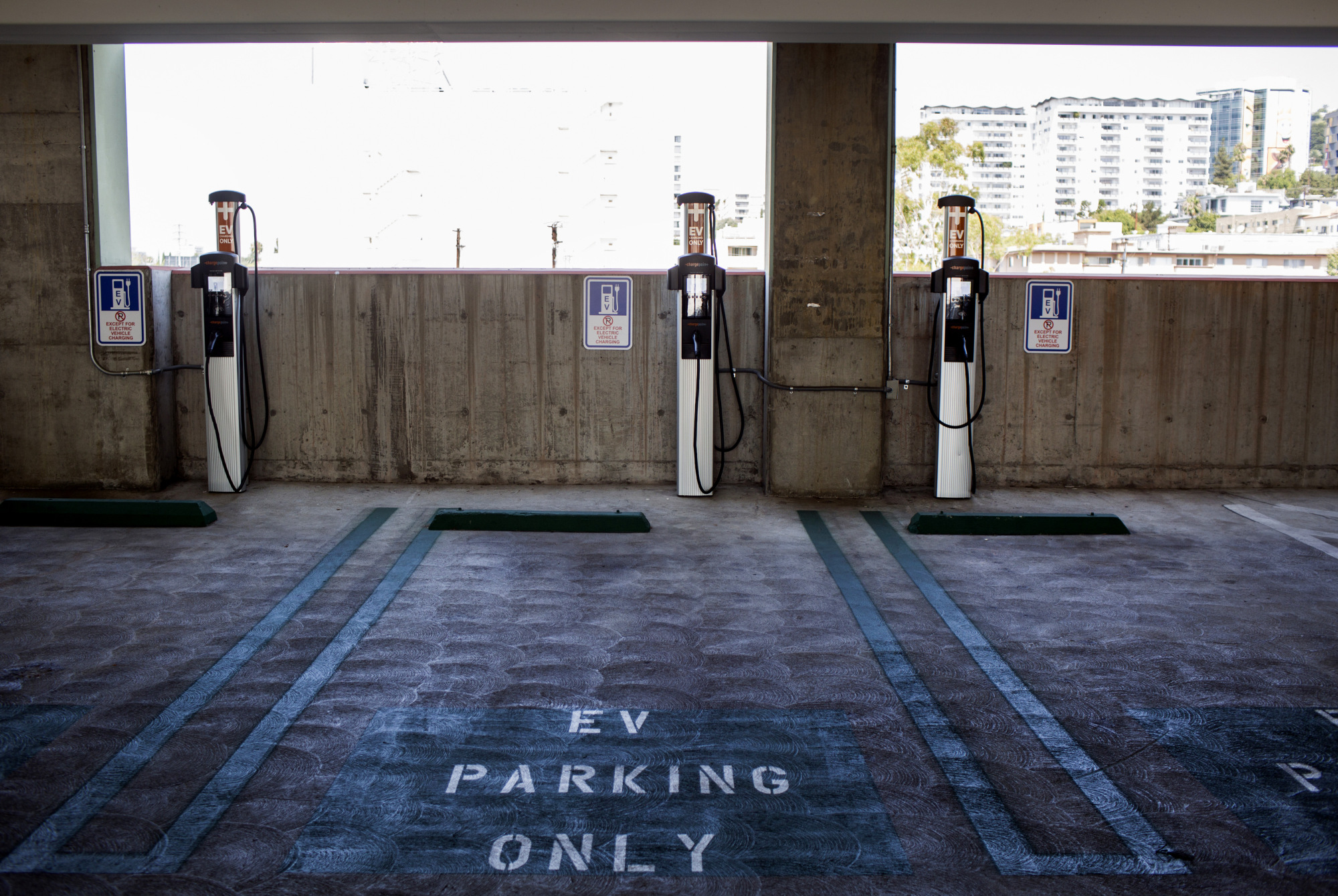Electric vehicle (EV) charging stations&nbsp;in a municipal parking lot in Los Angeles.