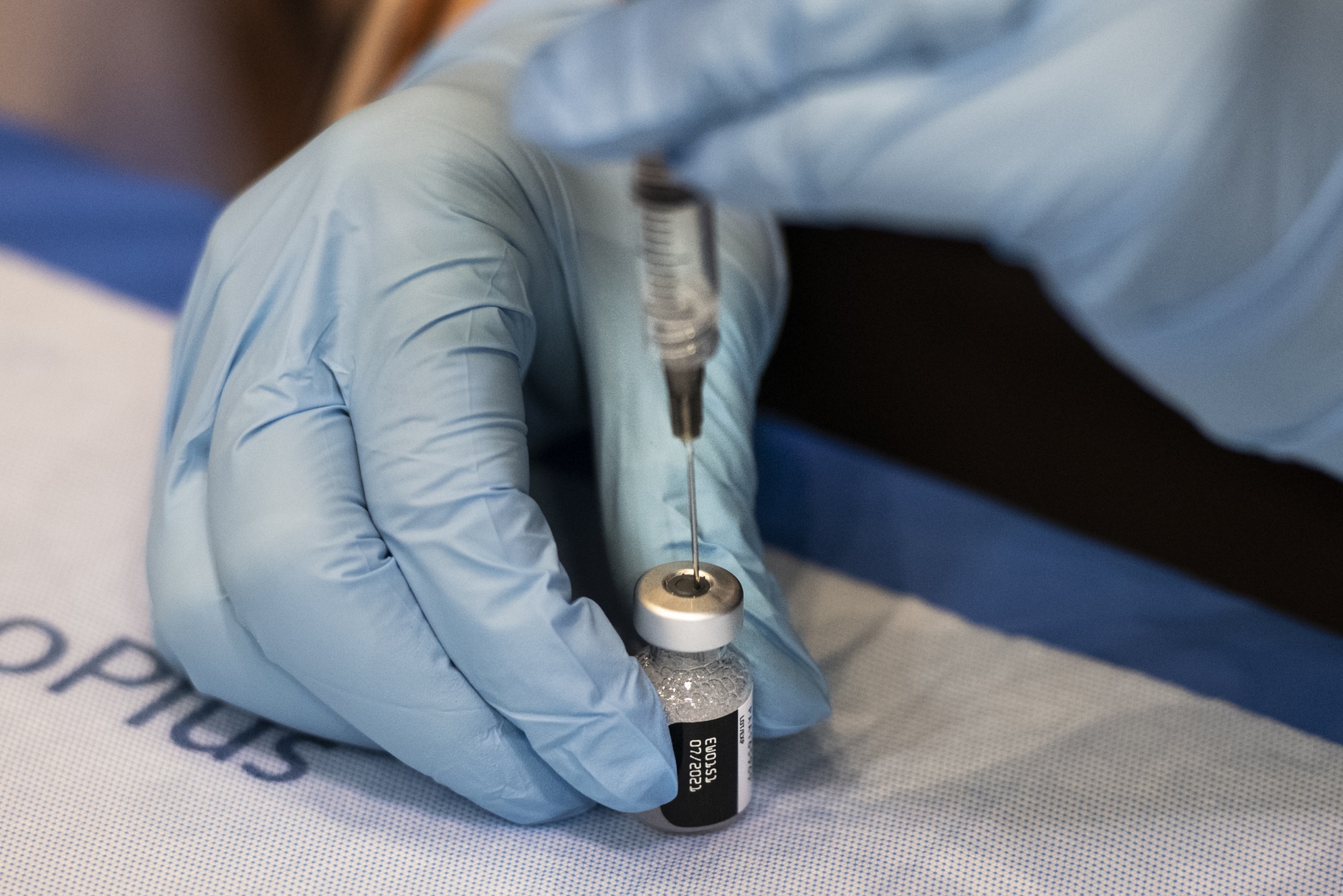 Vaccine-Givers Race Time at an Atlantic City Convention Hall