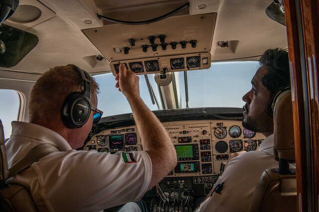 NCM pilots inside the cockpit during the demonstration seeding flight in March 2022. 