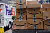 Amazon.com Inc. packages sit in front of a FedEx Corp. delivery truck in New York, U.S., on Monday, Nov. 26, 2018. Americans spent $50.6 billion online this month through Sunday, a 20 percent increase from a year ago and spearheaded by a 24 percent surge to $6.2 billion on Black Friday, according to Adobe Analytics. Cyber Monday is expected to add another $7.8 billion -- an 18 percent year-over-year gain for that day.