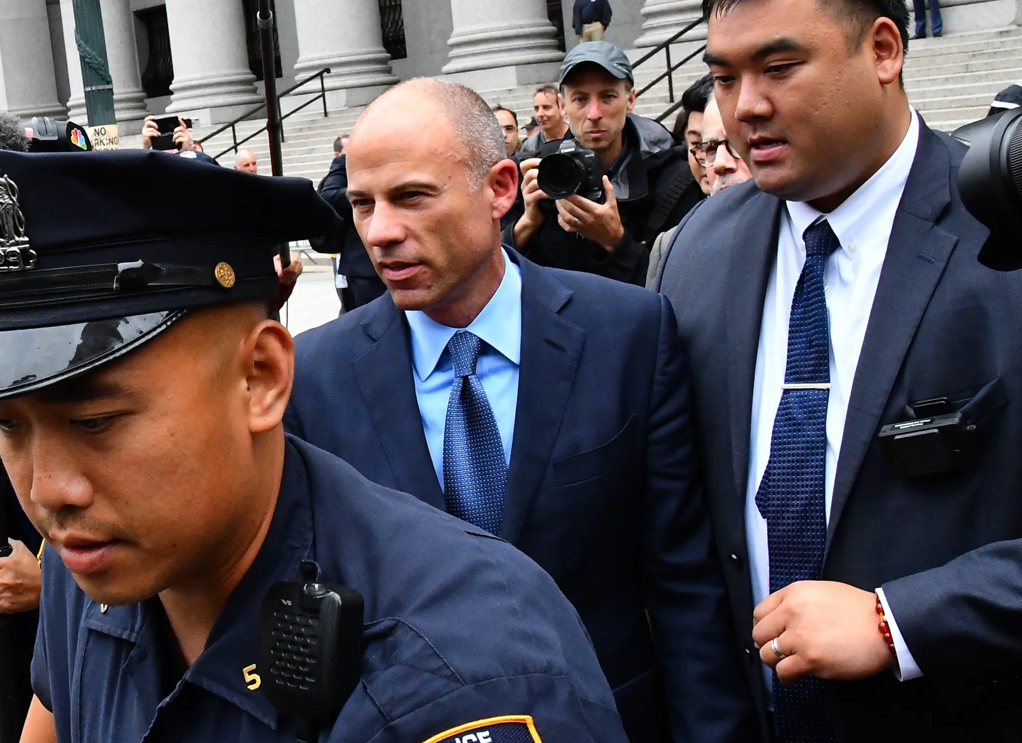 Michael Avenatti, center, exits from federal court in New York in 2019.