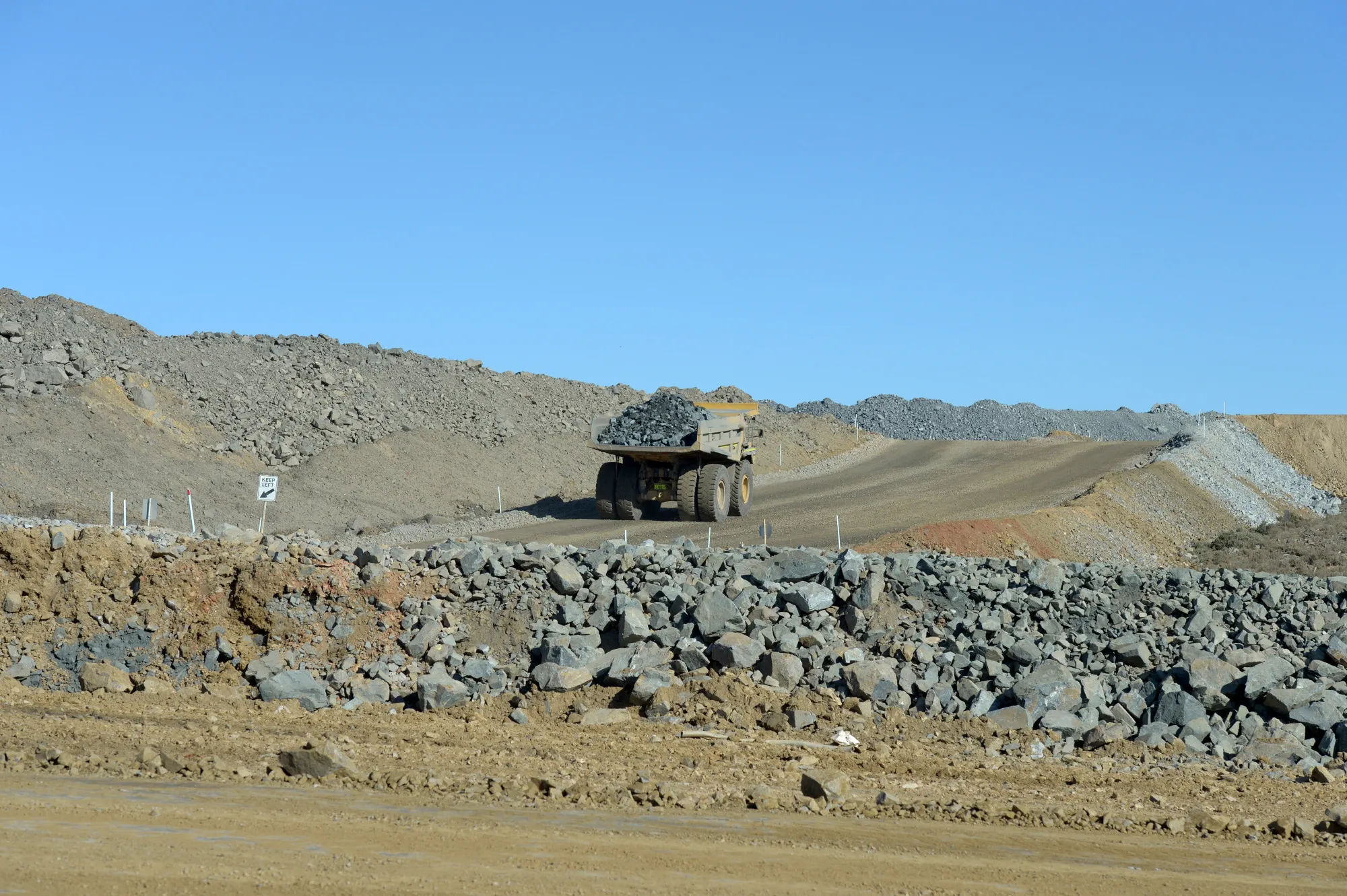 A dump truck filled with ore drives out of the White Foil open mine pit at Evolution Mining Ltd.'s gold operations in Mungari, Australia.