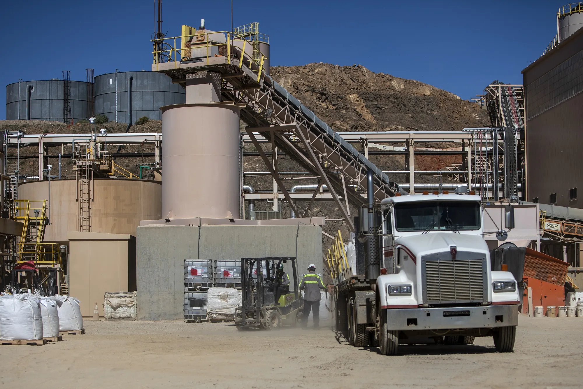 Employees load a truck with bags of rare earth concentrates at the Mountain Pass mine, operated by MP Materials, in Mountain Pass, California.