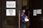A staff member walks out of&nbsp;a Covid-19 quarantine hotel in Hong Kong.&nbsp;