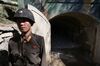 A North Korean soldier stands at the entrance to a tunnel at the Punggye-ri nuclear test site on May 24 in Punggye-ri, North Korea.