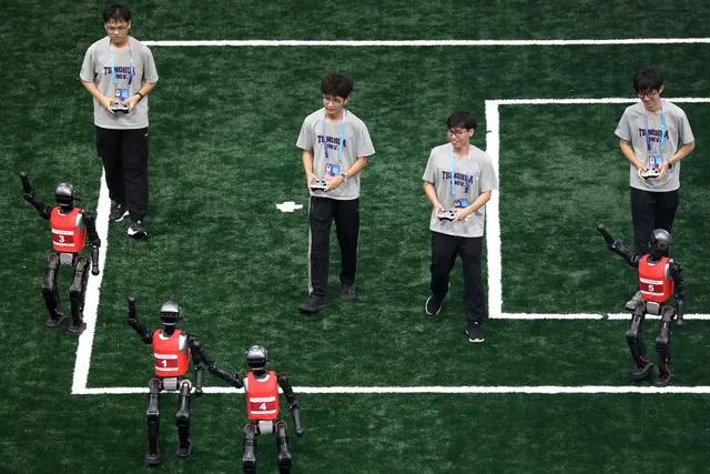 Image: Tsinghua Hephaestus Team, known for its work in advanced robotics and AI, competes in the World Humanoid Robot Games in Beijing in August.