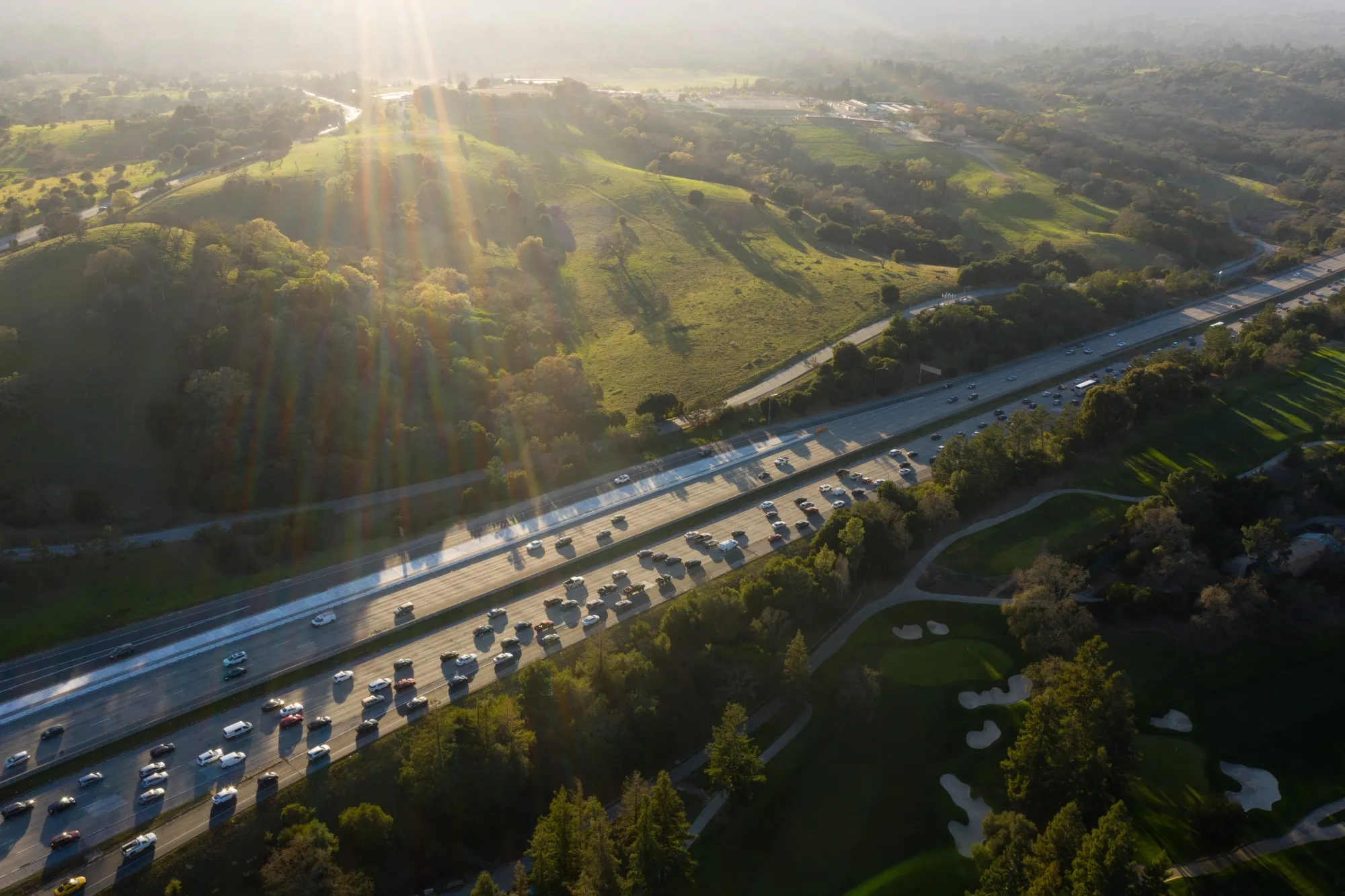 Vehicles drive along the 280 freeway in Menlo Park, California, US.