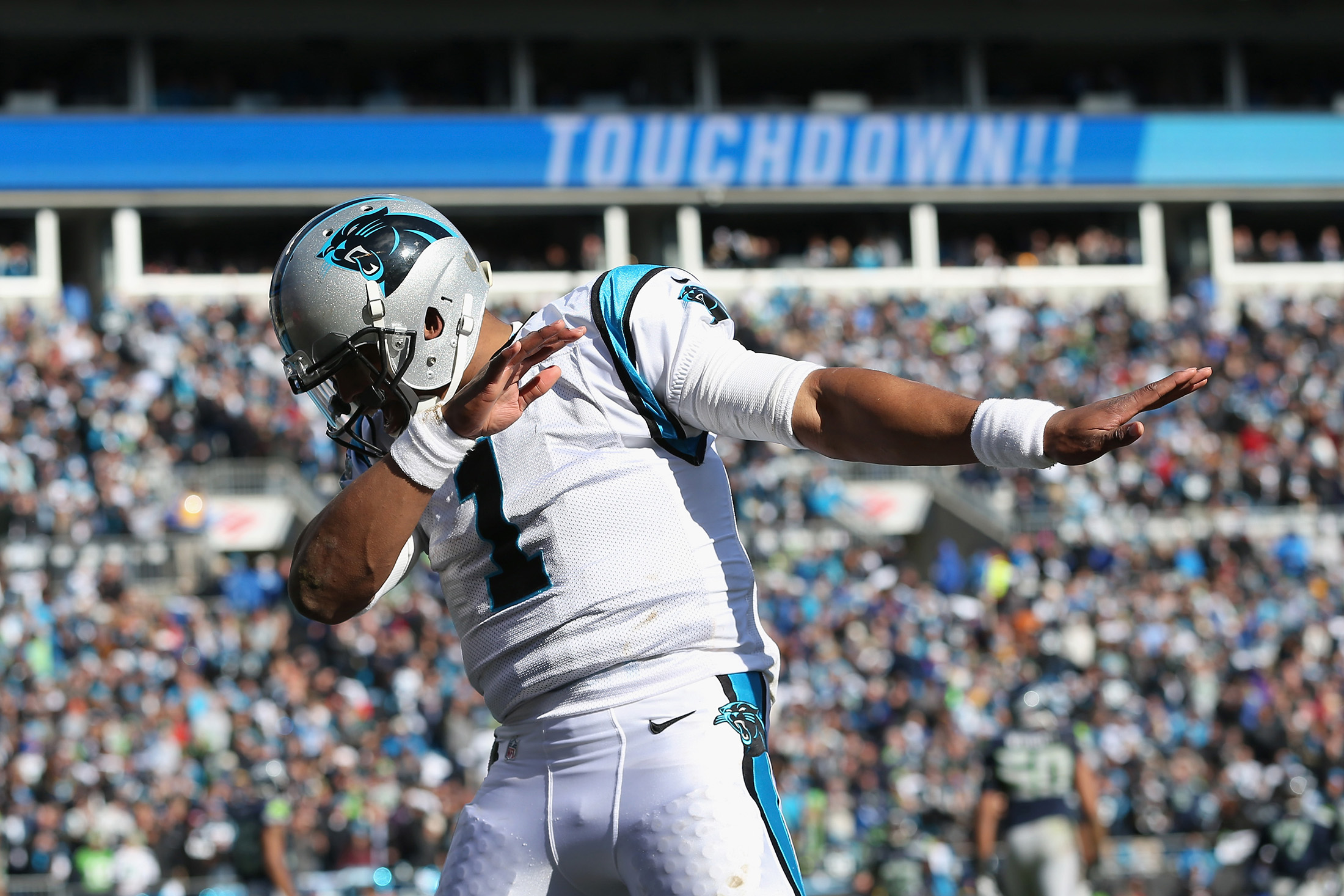 Download The Carolina Panthers' Cam Newton Celebrates a Touchdown Wallpaper