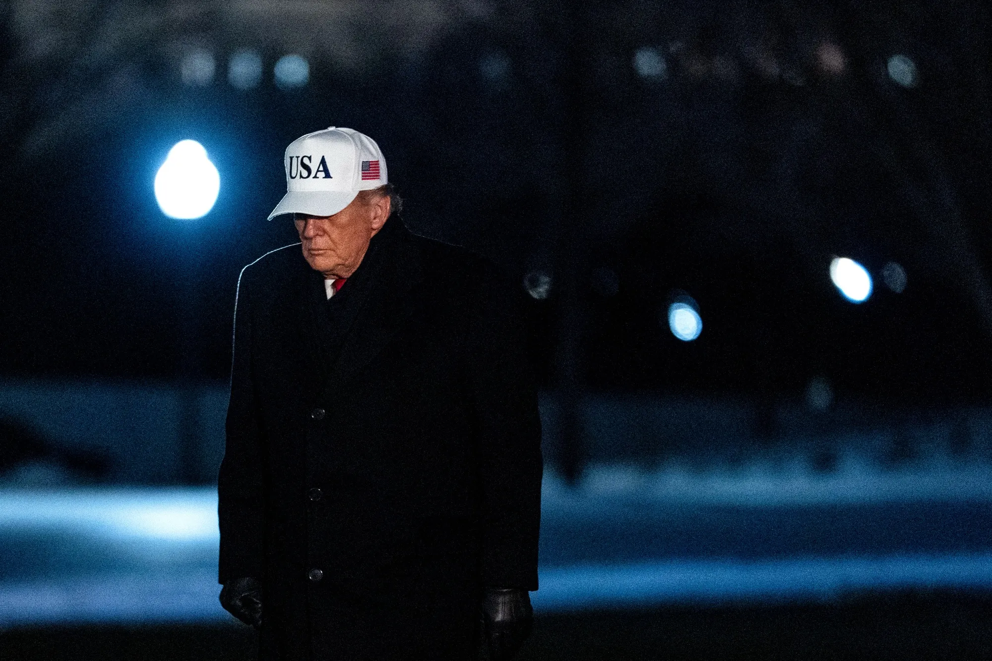 US President Donald Trump walks on the South Lawn of the White House.