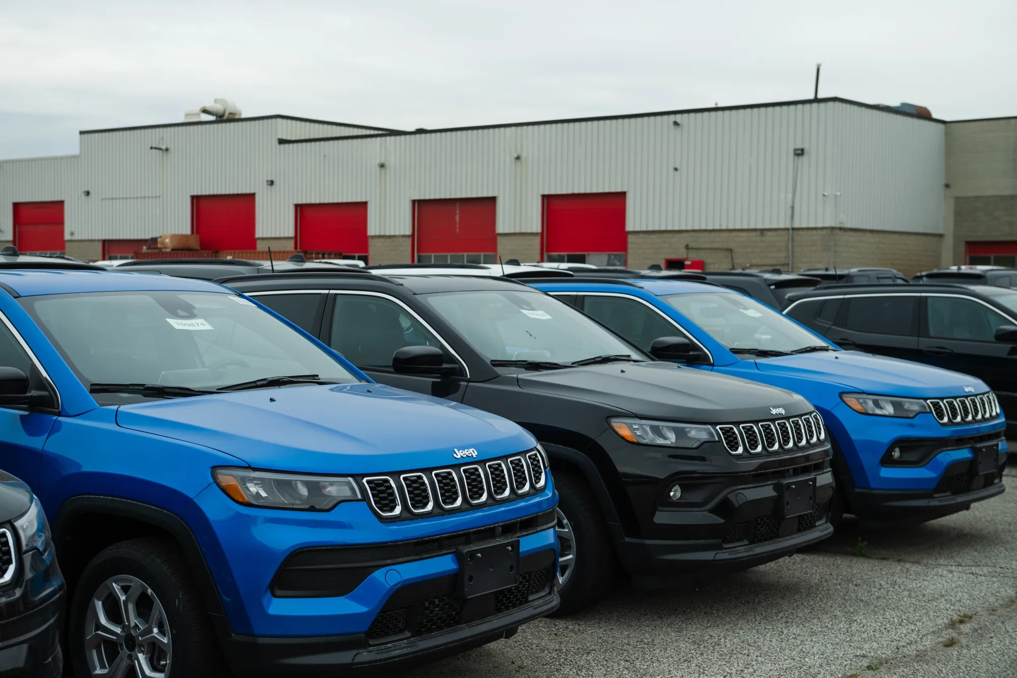 Jeep Compass SUVs at a dealership in Mississauga, Ontario, Canada.