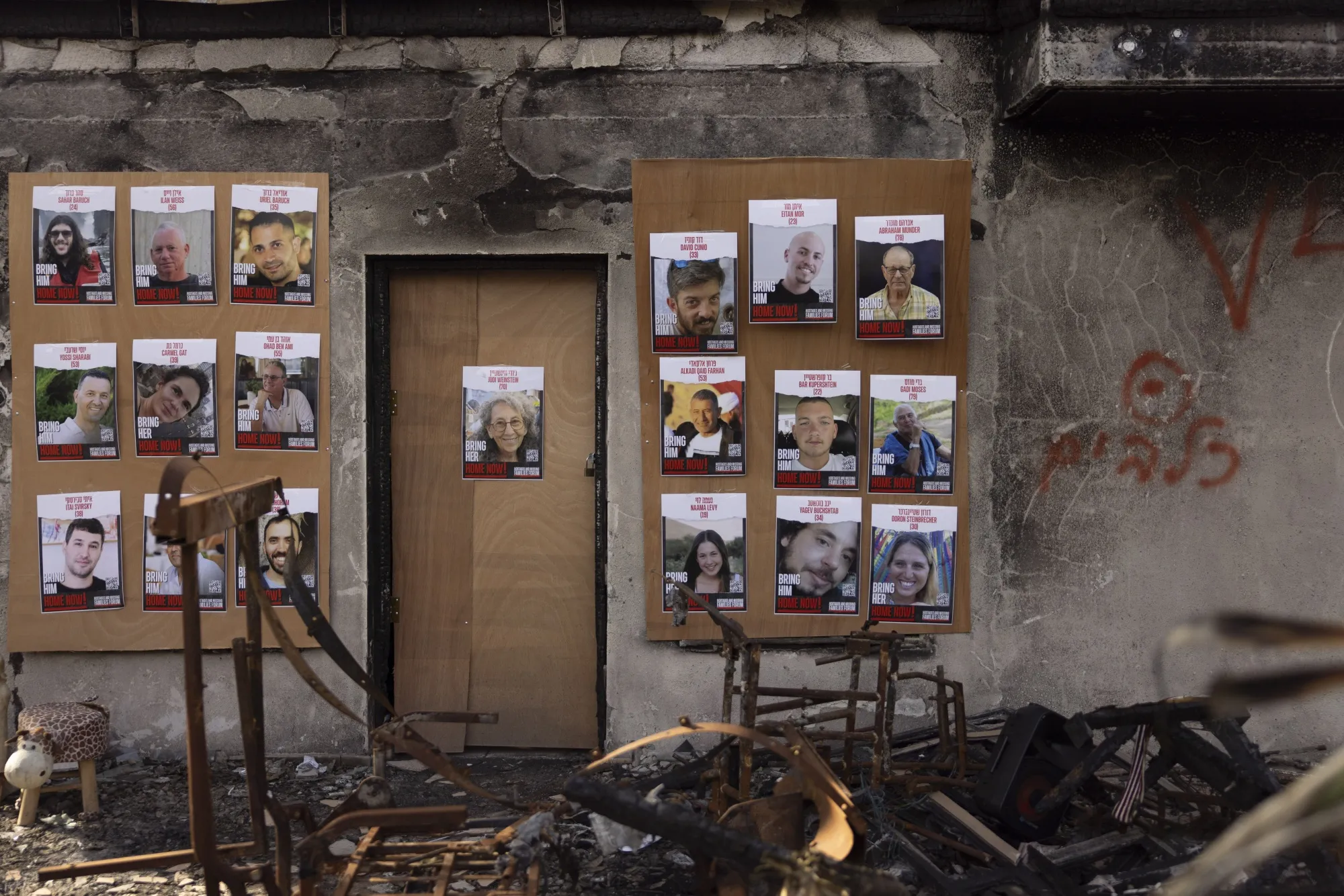 Placards of&nbsp;Israeli hostages held by Hamas hang in destroyed house in Be’eri, Israel, on Dec. 20,&nbsp;2023.&nbsp;