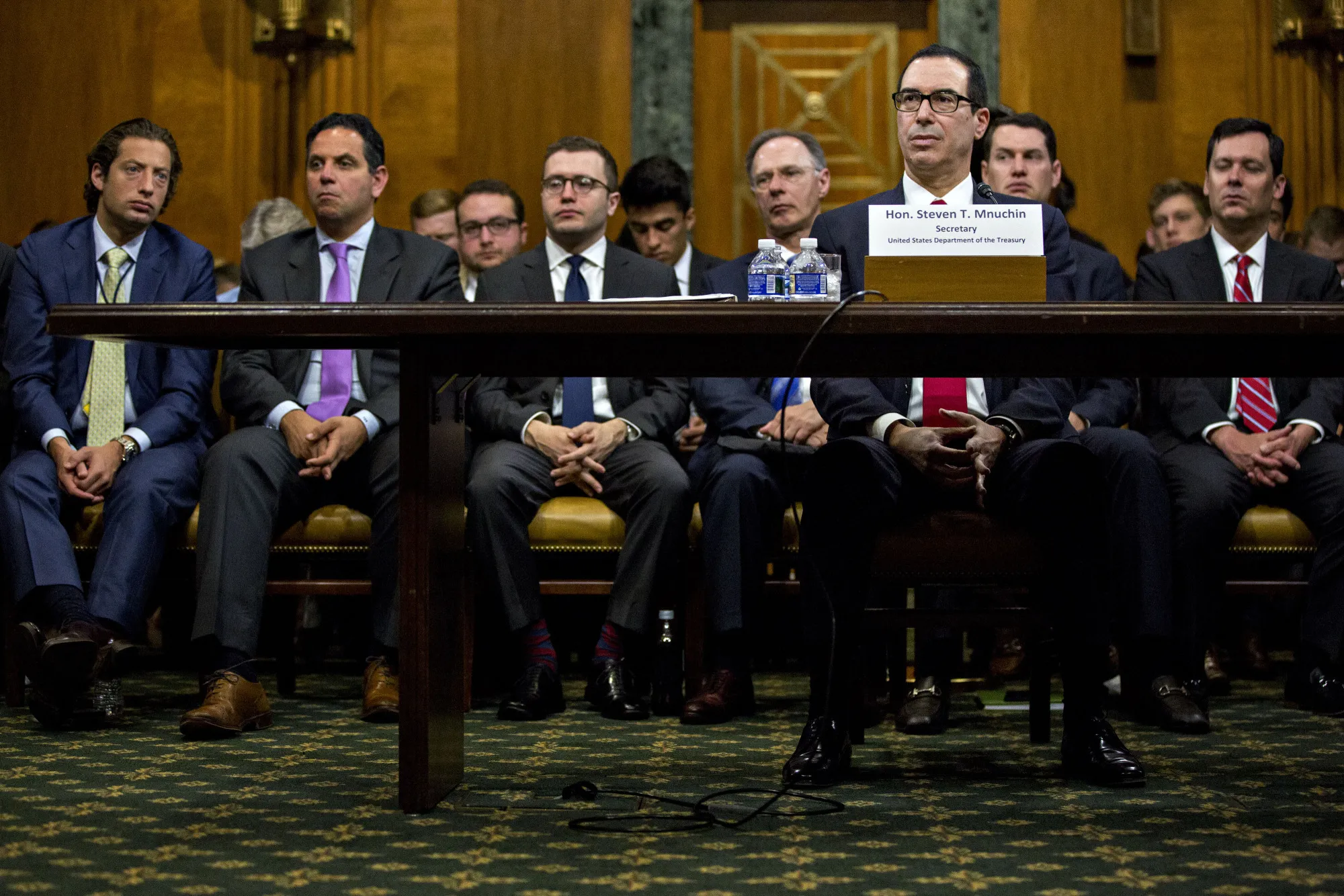 Steven Mnuchin, U.S. Treasury secretary, center right, listens during a Senate Budget Committee hearing in Washington, D.C., on June 13, 2017.
