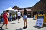 Incoming freshmen wait in line while arriving on campus at University of Colorado Boulder.
