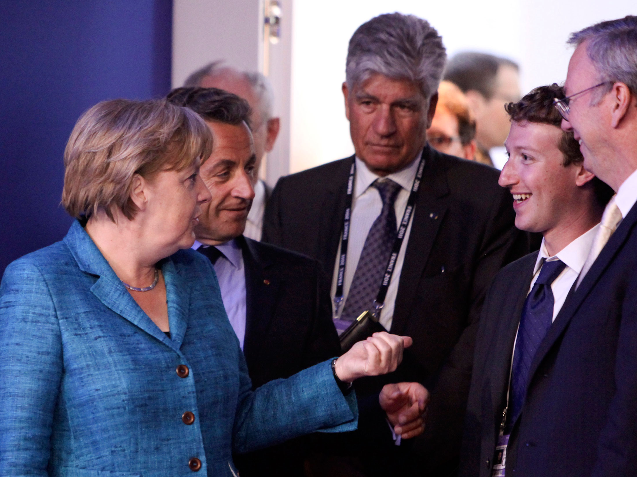 Mark Zuckerberg, founder of Facebook Inc. meets Angela Merkel, Germany's chancellor as they arrive for the internet session of the Group of Eight summit in Deauville, France, on Thursday, May 26, 2011.
