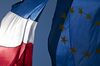 A European Union (EU) flag, right, and a French national flag fly from a building in Toulouse, France, on Wednesday, Aug. 14, 2013. The French economy posted its best quarterly expansion since President Francois Hollande came to power in May 2012 as recovering consumer spending and exports lifted factory output.