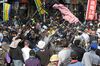 Protestors remove barricades set up outside the parliament building