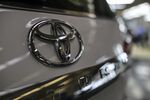The Toyota Motor Corp. logo is displayed on a vehicle sitting at the Toyota Kirloskar Motor Ltd. plant