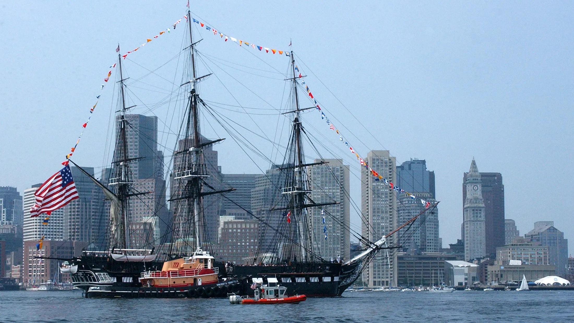 BOSTON - JUNE 11: In this handout photo provided by the U.S. Coast Guard, multiple Coast Guard resources escort the USS Constitution, Boston's beloved 'Old Iron Sides,' June 11, 2005 in Boston, Massachusetts. The boat went out to an island in south Boston where the USS Constitution fired its 21 gun salute and was then brought back to her dock in Charlestown Navy Yard.
