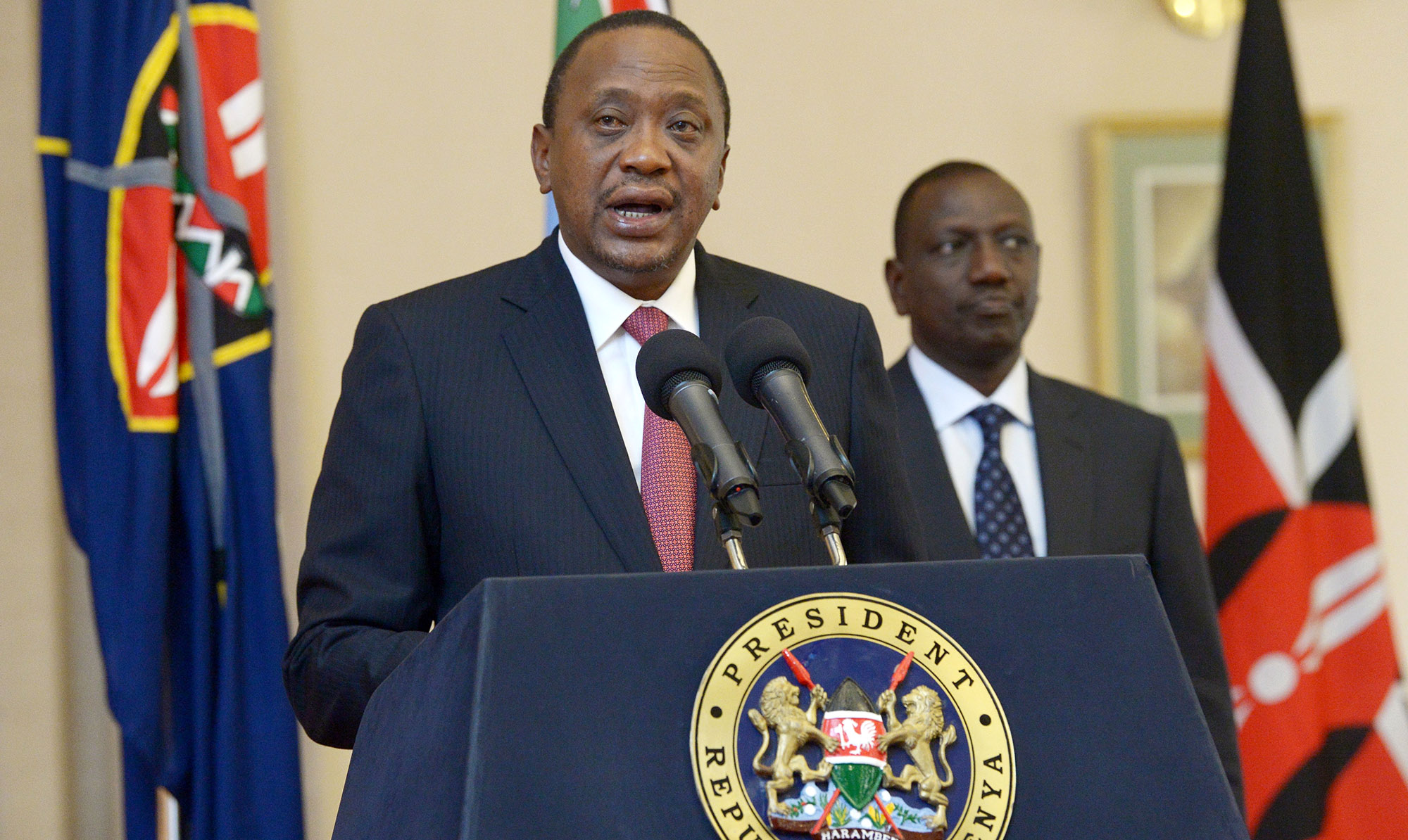 Uhuru Kenyatta speaks next to William Ruto&nbsp;in Nairobi in 2017.