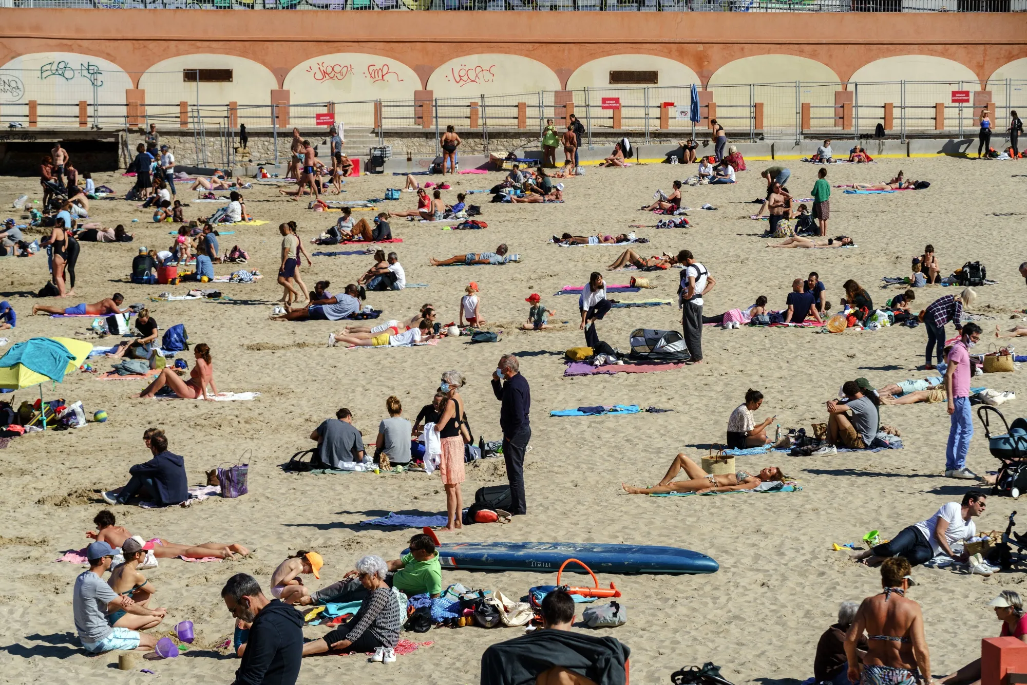 Sunbathers on Catalan beach in Marseille in April.