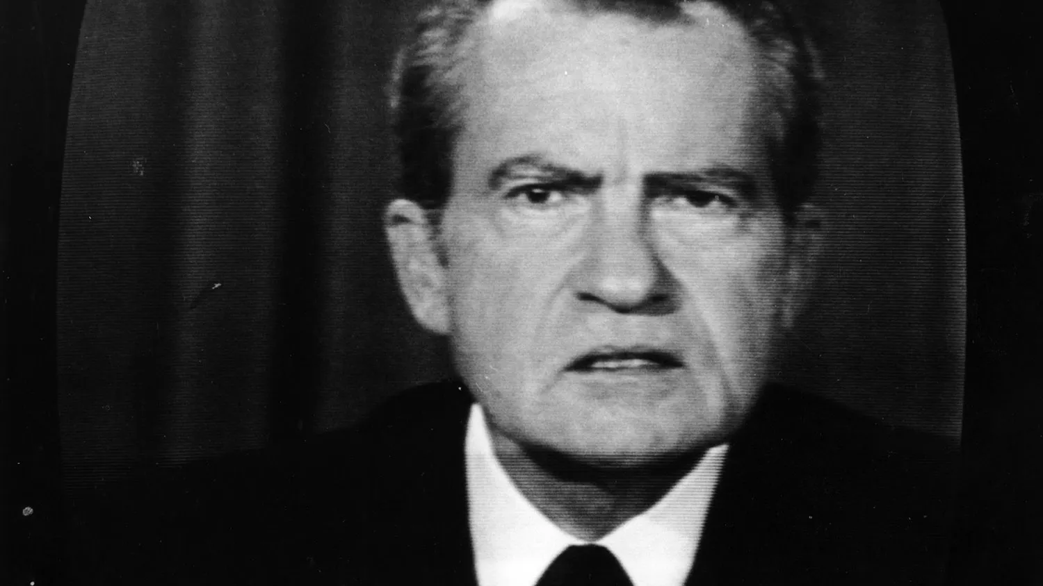 The 37th President of the United States, Richard Nixon, on a television screen.
