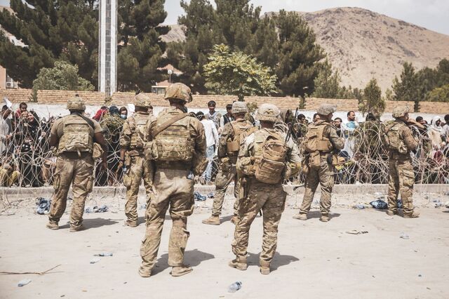 US soldiers and Marines assist with security during an evacuation at Hamid Karzai International Airport on Aug. 19, 2021. 