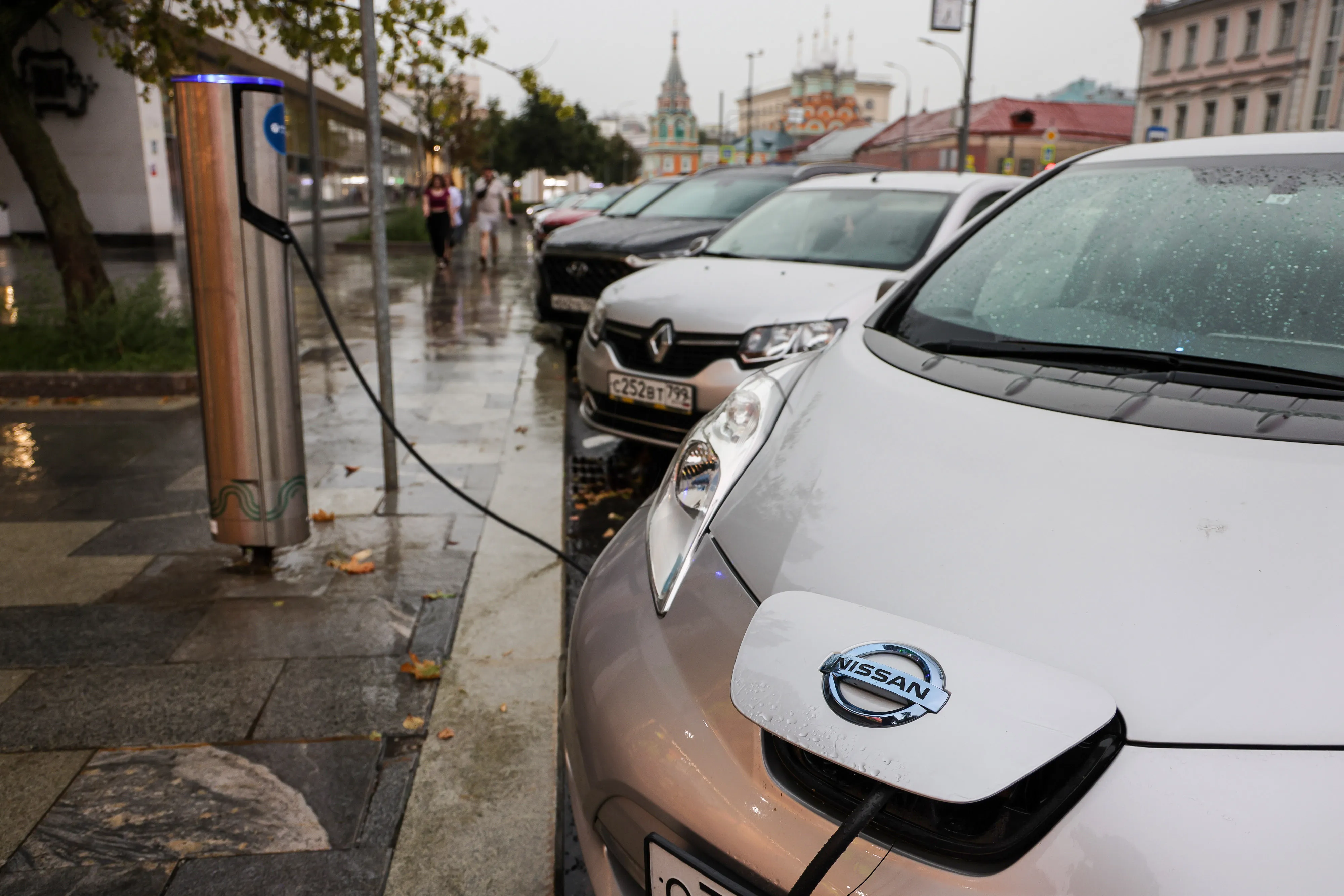 A Nissan Leaf electric automobile charges at a vehicle charging point in Moscow, Russia.