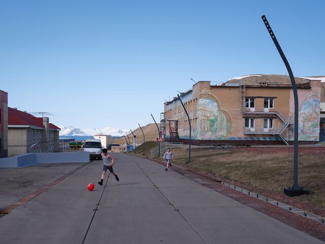 Children playing football outside the school in Barentsburg. Whereas Longyearbyen is closing its last coal mine, there are no plans to follow suit in Barentsburg, where Arktikugol has invested in improving facilities for workers and their families while diversifying into tourism. 