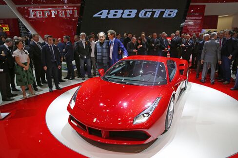 Ferrari SpA Chairman Sergio Marchionne alongside a Ferrari 488 GTB at Geneva International Motor Show in March 2015. Photographer: Gianluca Colla/Bloomberg