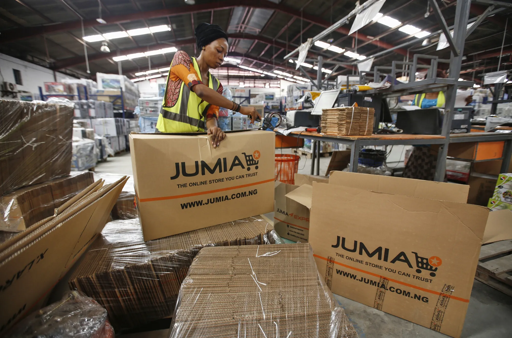 A worker packages goods inside a Jumia distribution warehouse in Lagos.