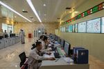 Chinese engineers work in a control room at the Port Qasim coal power plant in Port Qasim, Pakistan, in 2018.