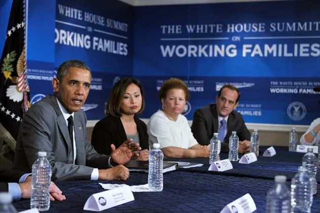 President Barack Obama takes part in a round table discussion during the White House Summit on Working Families on June 23 