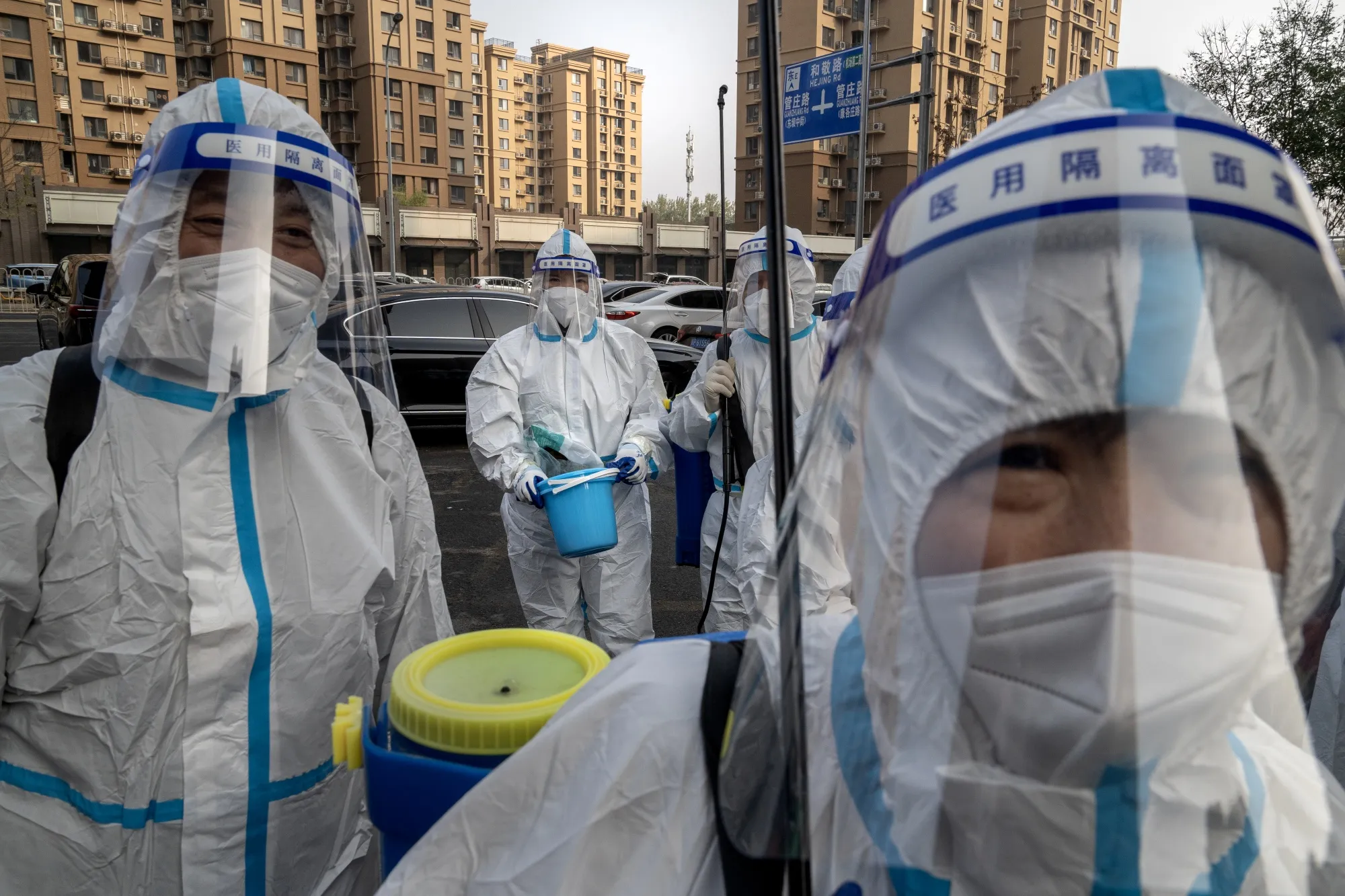 Workers in protective gear at a neighborhood&nbsp;under Covid-19 lockdown in Beijing on Nov. 10.