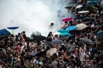 Police fire tear gas at demonstrators during a protest near central government offices in Hong Kong on Sept. 28. Pro-democracy protesters kick-started their campaign to occupy central Hong Kong after police clashed with students demanding that China withdraw proposals to control the city’s elections