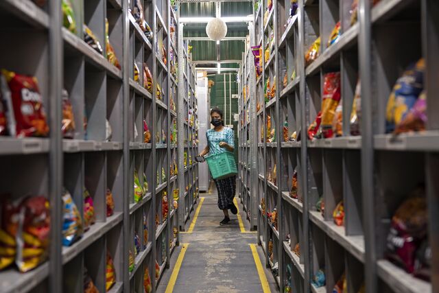 A picker rushes to fulfill an order at a Flipkart dark store in Bengaluru. Photographer: Sameer Raichur/Bloomberg