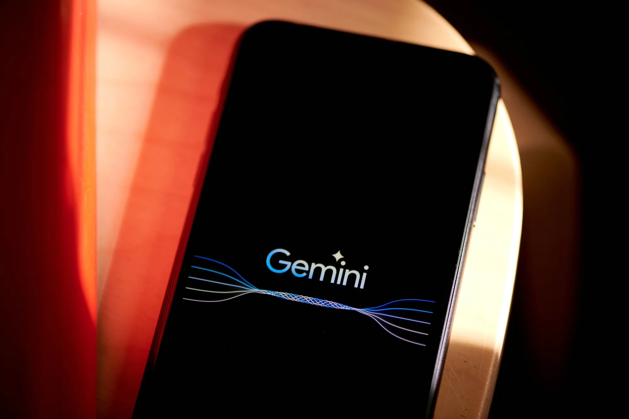 The Gemini logo on a smartphone.