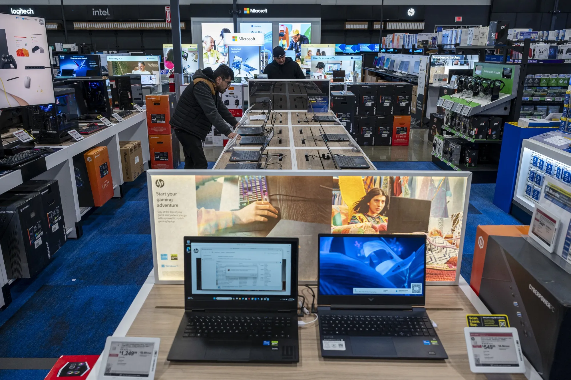 HP laptop computers inside a Best Buy store. The company hopes its acquisition of AI startup Humane’s assets helps spur artificial intelligence innovation for its products.
