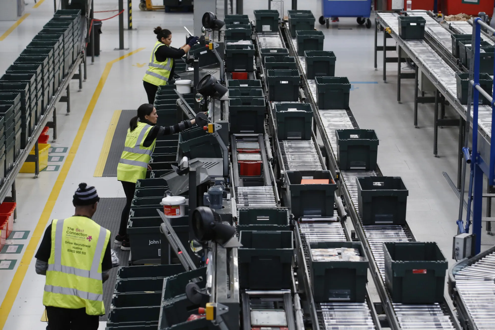 Workers pick stock for store replenishment at the John Lewis Plc customer fulfilment and distribution centre in Milton Keynes, U.K., on Friday, Nov. 17, 2017. John Lewis Plc operates as a departmental store; retailing home and electronic appliances, furniture, clothing, nursery products, sports and leisure items, and toys among others.
