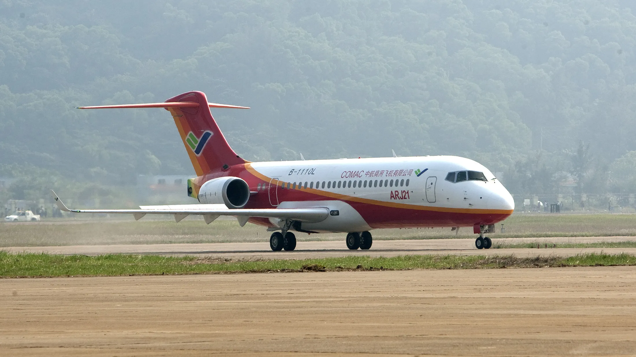 A Commercial Aircraft Corp. of China (Comac) ARJ21 regional passenger airplane taxis after a flight during the Airshow China 2010 in Zhuhai, Guangdong province, China, on Wednesday, Nov. 17, 2010. Comac announced its first 100 C919 passenger-plane orders, breaking Airbus SAS and Boeing Co.'s stranglehold on the world's second-largest market for new aircraft.
