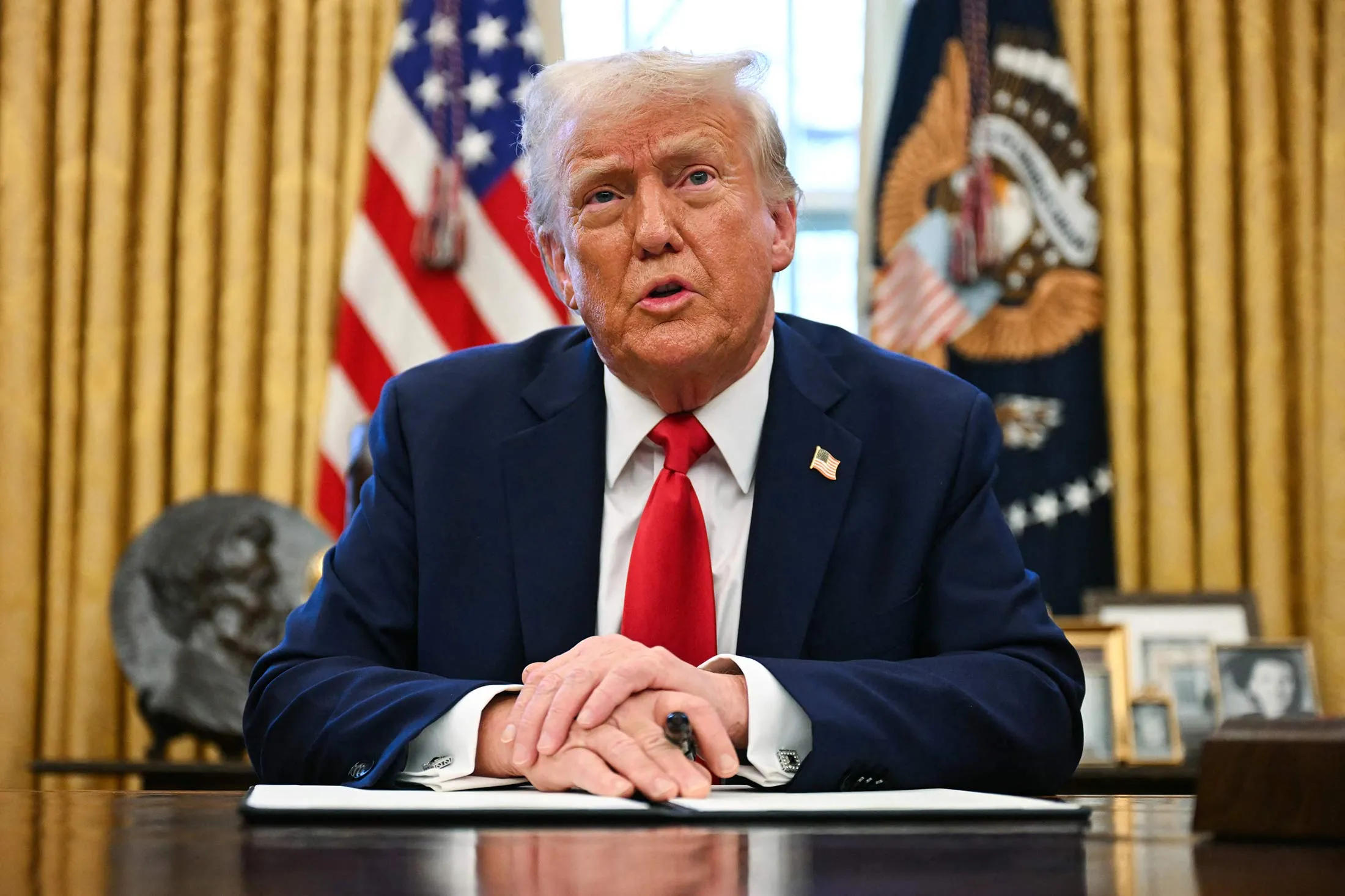 President Donald Trump speaks to the press as he signs an executive order to create a US sovereign wealth fund, in the Oval Office of the White House in Washington, DC, on Feb. 3, 2025.